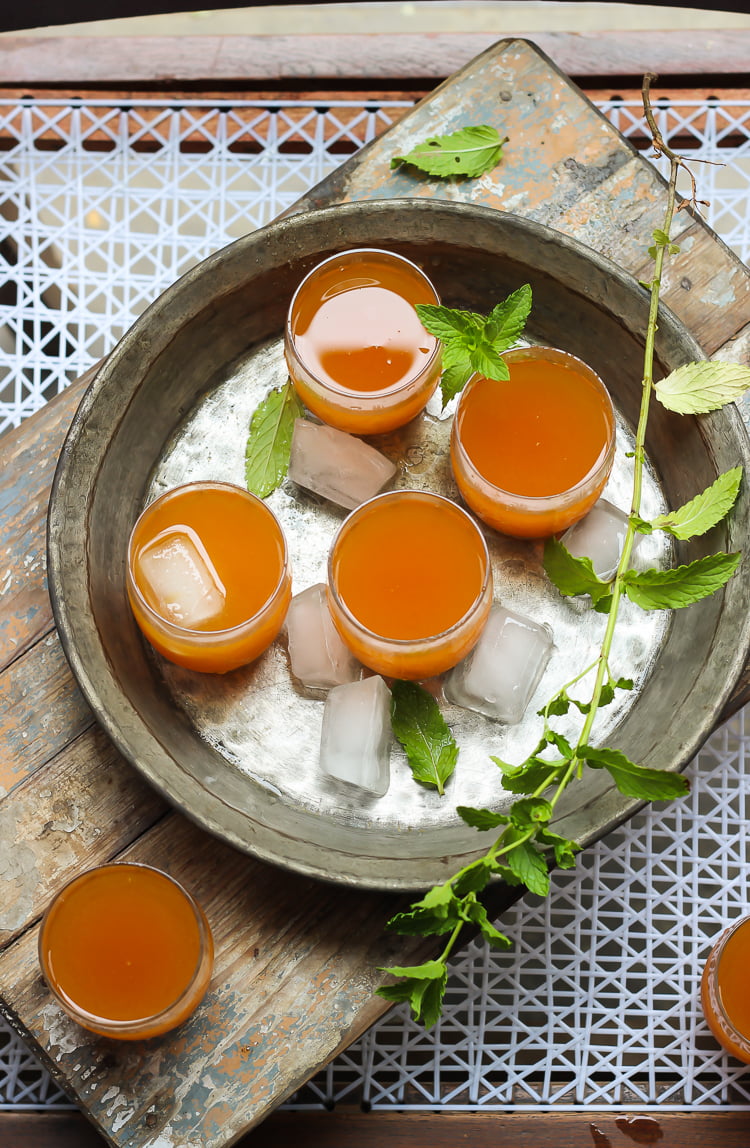 A chilled glass of Bel Ka Sharbat, perfect for sipping on a hot day