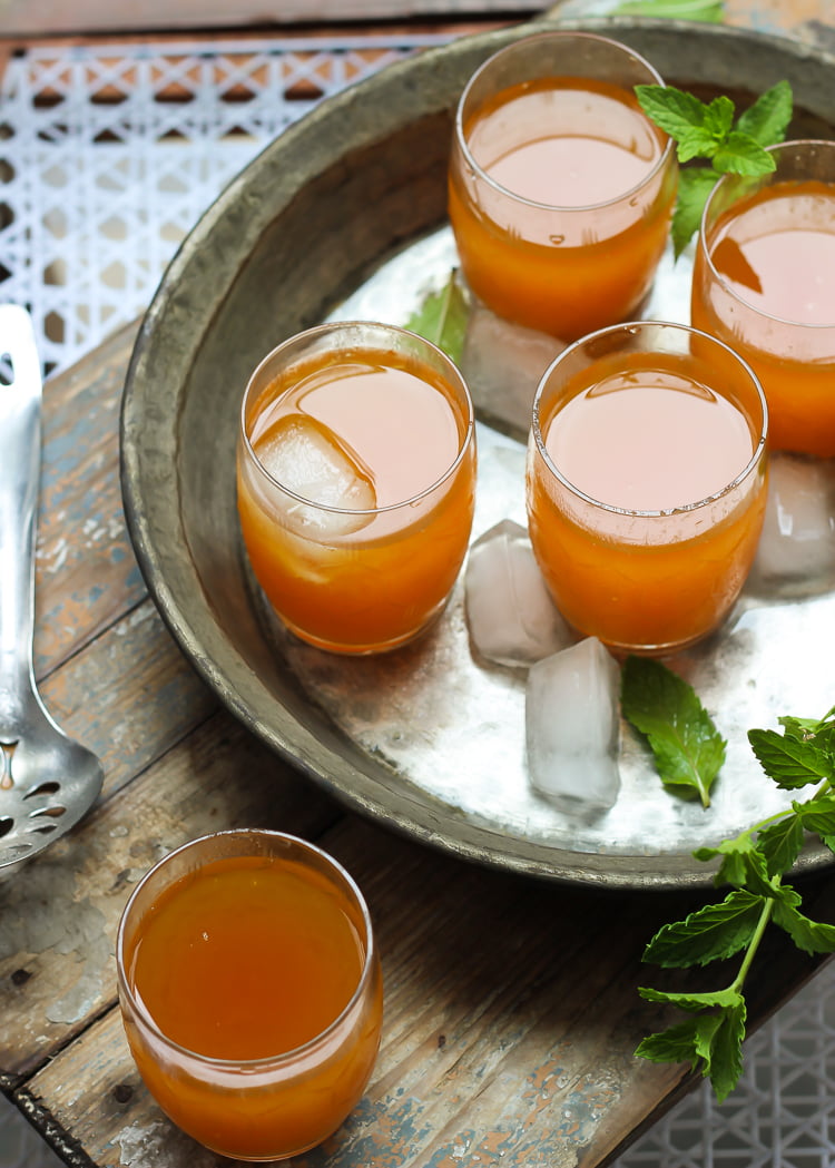 A refreshing glass of Wood Apple Juice enjoyed outdoors, capturing the essence of summer
