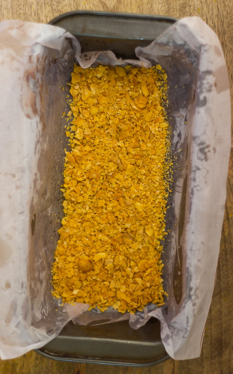 Vegetable loaf topped with the crushed flakes placed in a baking tray