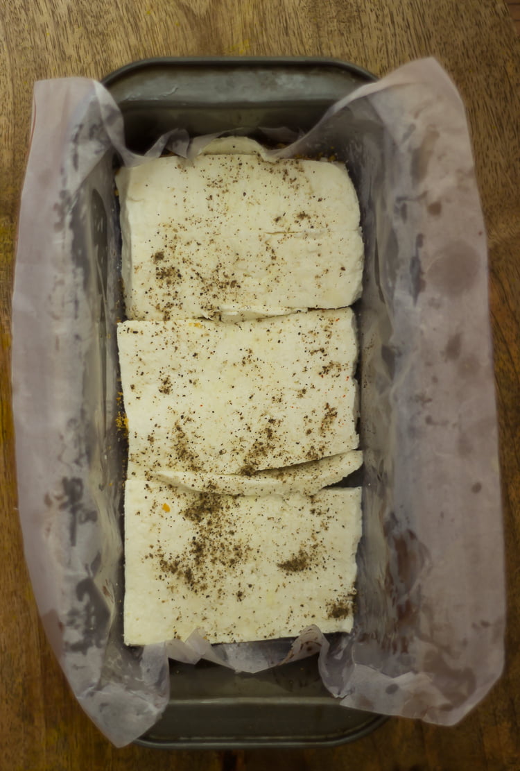 A layer of sliced paneer placed on the top of vegetable loaf