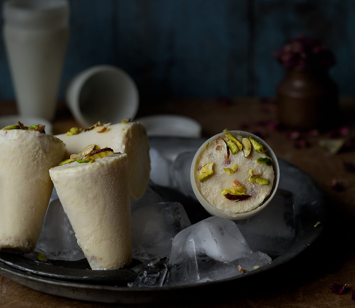 Homemade Malai Kulfi topped with nuts, served in a plate