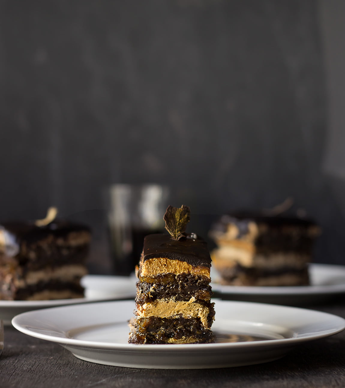 A slice of opera cake served in a plate, perfect for any occasion