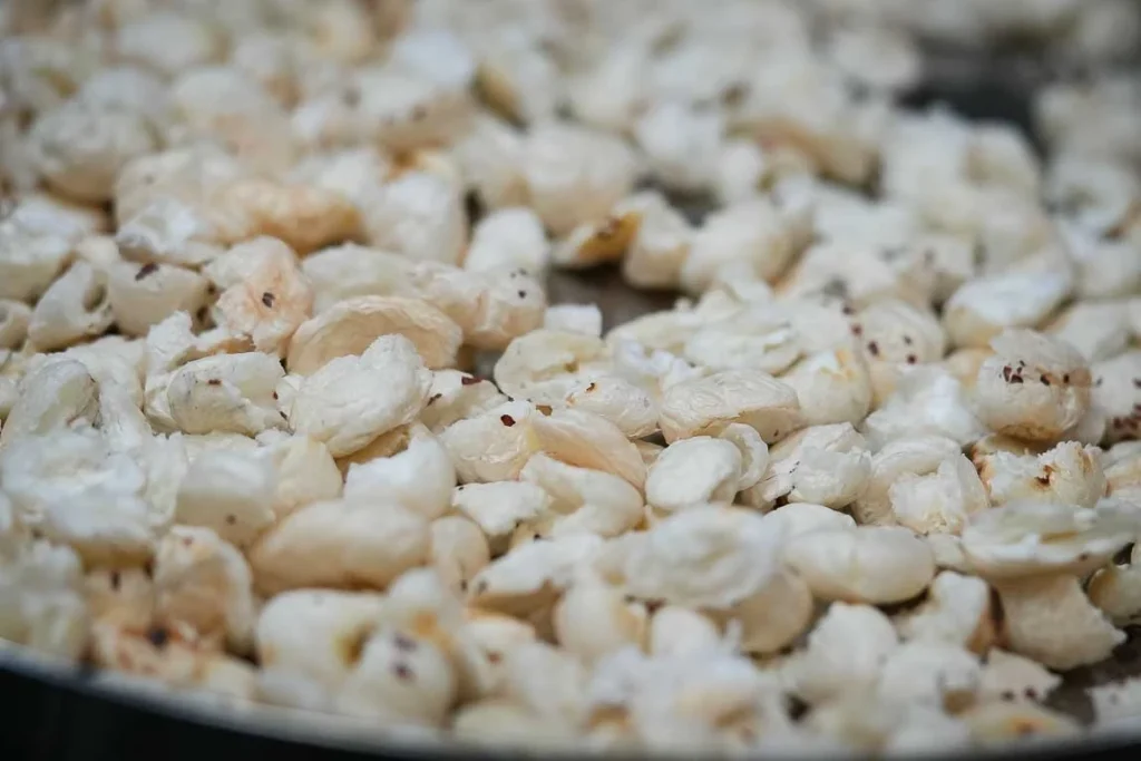 Roasted edible gond crystals puffing up in hot ghee