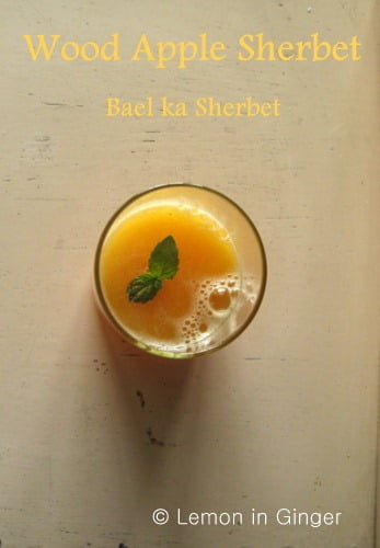 Bel Ka Sharbat in a glass, garnished with fresh mint leaves for an added touch of flavor