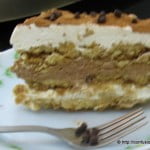 A slice of eggless tiramisu served on a plate