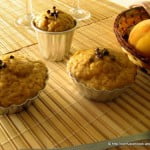 Close-up view of eggless banana peach muffins with a golden-brown crust