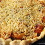Close-up of a slice of Pasta Tart, showcasing the layers of pasta and cheese