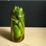 Jar of Bharwa Hari Mirch ka Achar with stuffed green chilies and spices