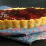 Close-up of a strawberry pie with juicy strawberry filling and a flaky crust