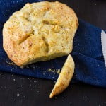 Healthy Zucchini Bread served on a wooden board with a slice ready to eat