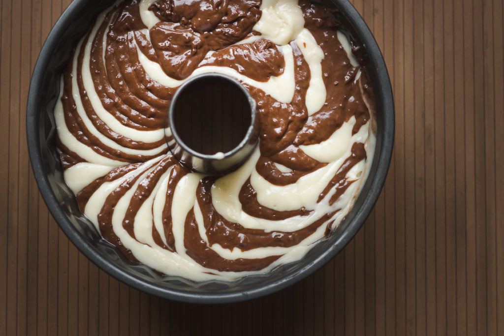 Mixing bowl with chocolate and vanilla batter ready for creating Zebra Cake