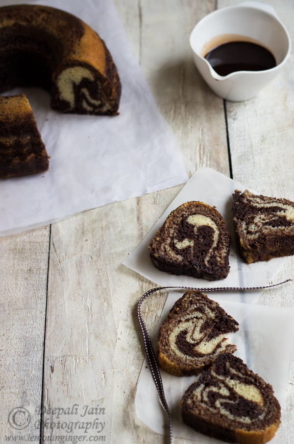 Overhead shot of a sliced Chocolate Zebra Cake served on a wooden table