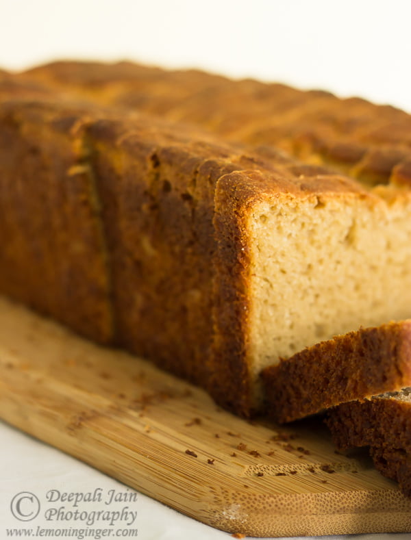Close-up of the crusty top of a whole wheat bread loaf, golden and firm