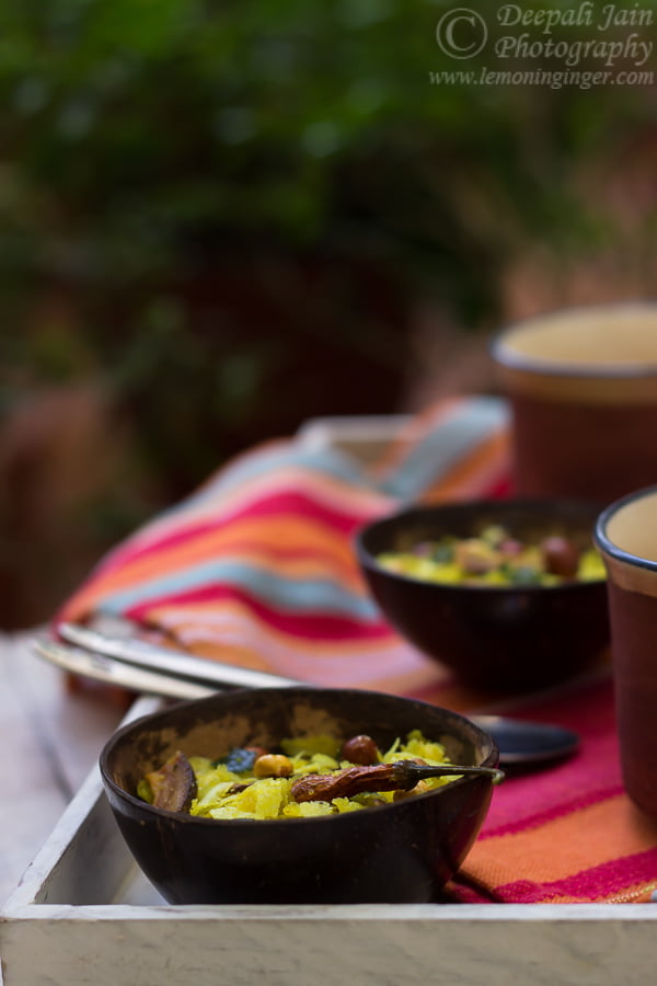 Close-up of a handful of Chivda Namkeen showing the texture and variety of ingredients