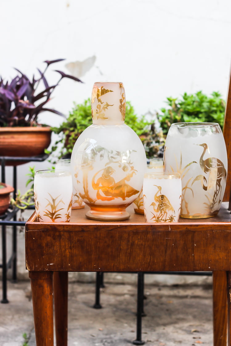 Overhead view of Rooh Afza Sharbat in a glass with ice cubes and lemon wedges