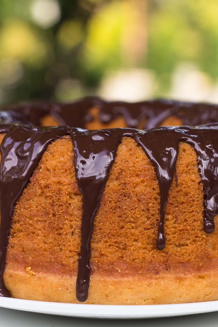 A whole Classic Vanilla Bundt Cake on a decorative cake stand