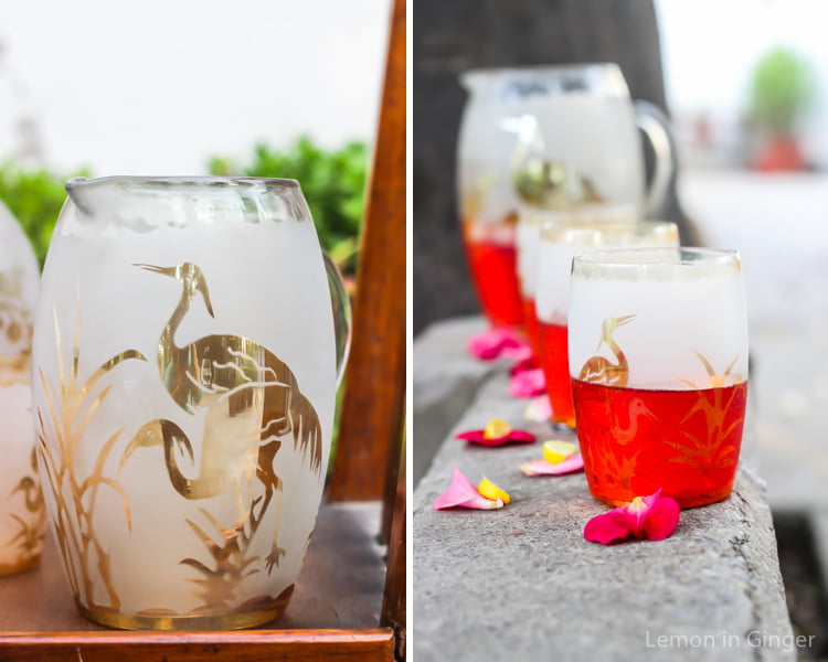 A pitcher of Rooh Afza Sharbat surrounded by fresh mint and lemon slices
