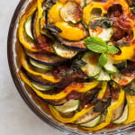 A top view of a beautifully arranged Baked Ratatouille with overlapping vegetable slices