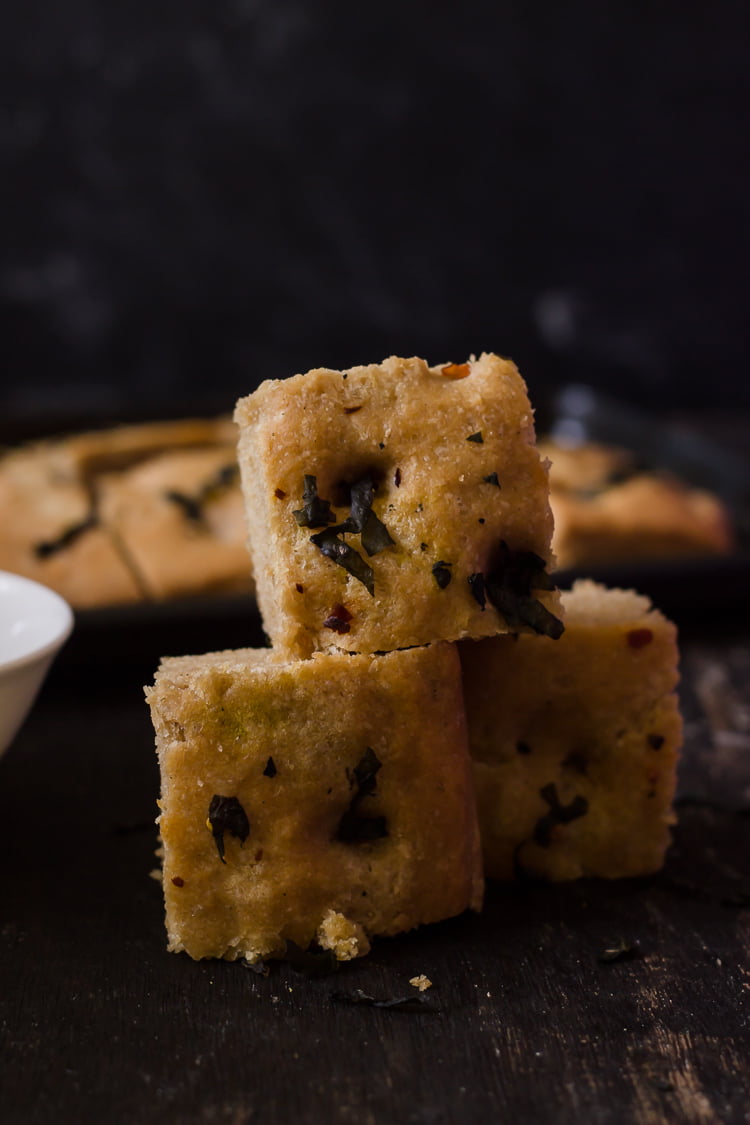 Close-up view of the slices of whole wheat basil focaccia bread