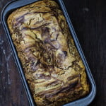 Top view of the Eggless Chocolate Vanilla Swirl Cake with a rich, glossy chocolate glaze