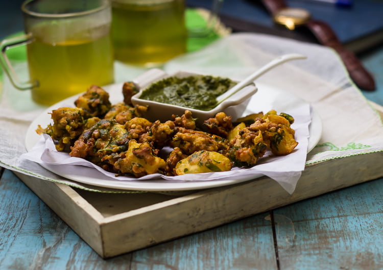 A side view of a stack of Aloo Bread Pakoris, highlighting their crispy texture
