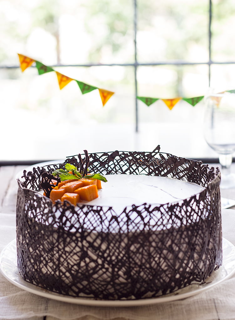 Close-up of an eggless mango white cake on a plate