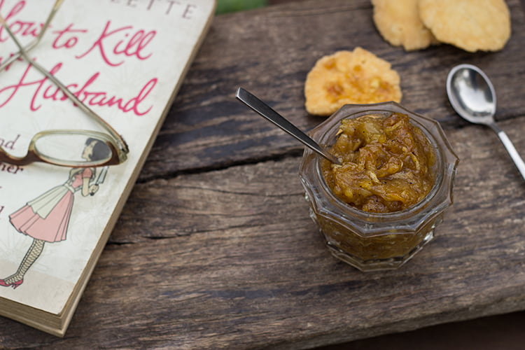 A bowl full of Kairi ki Khatti Meethi Chutney, paired with Indian snacks