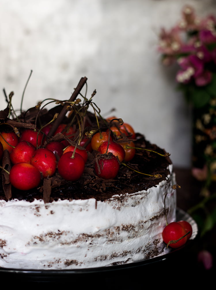 Close-up of the layers inside an eggless black forest cake showing rich chocolate and cream
