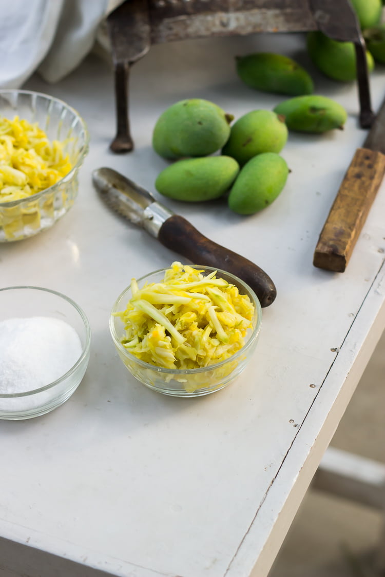 Peeled and grated raw mangoes in a bowl