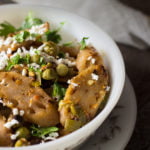 A bowl of Kamal Kakdi Ki Sabji garnished with grated paneer