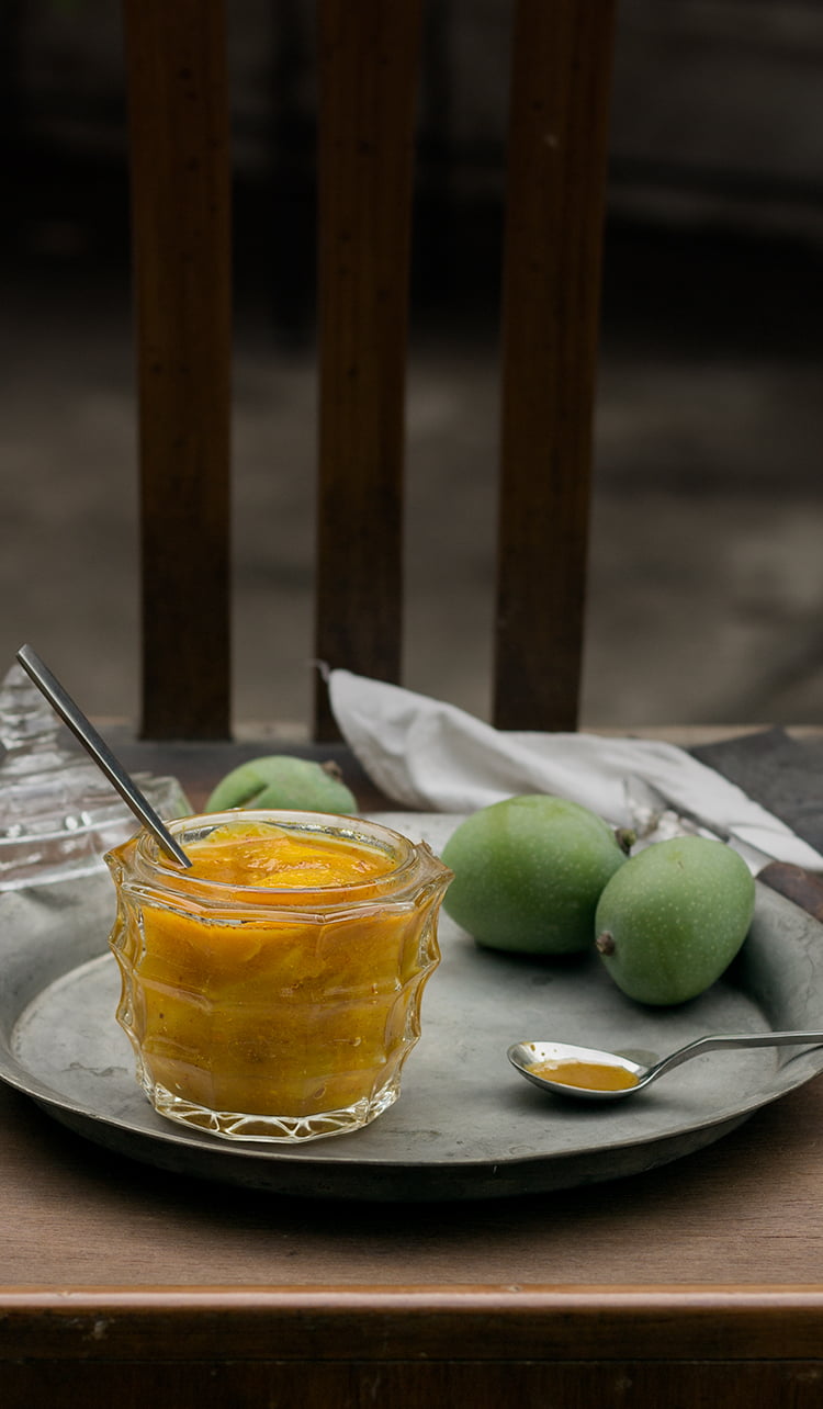 Homemade Aamras (raw mango chutney) served in a traditional bowl