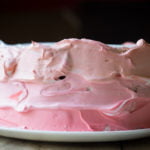 Beautifully decorated Eggless Strawberry Ombre Cake ready to be served