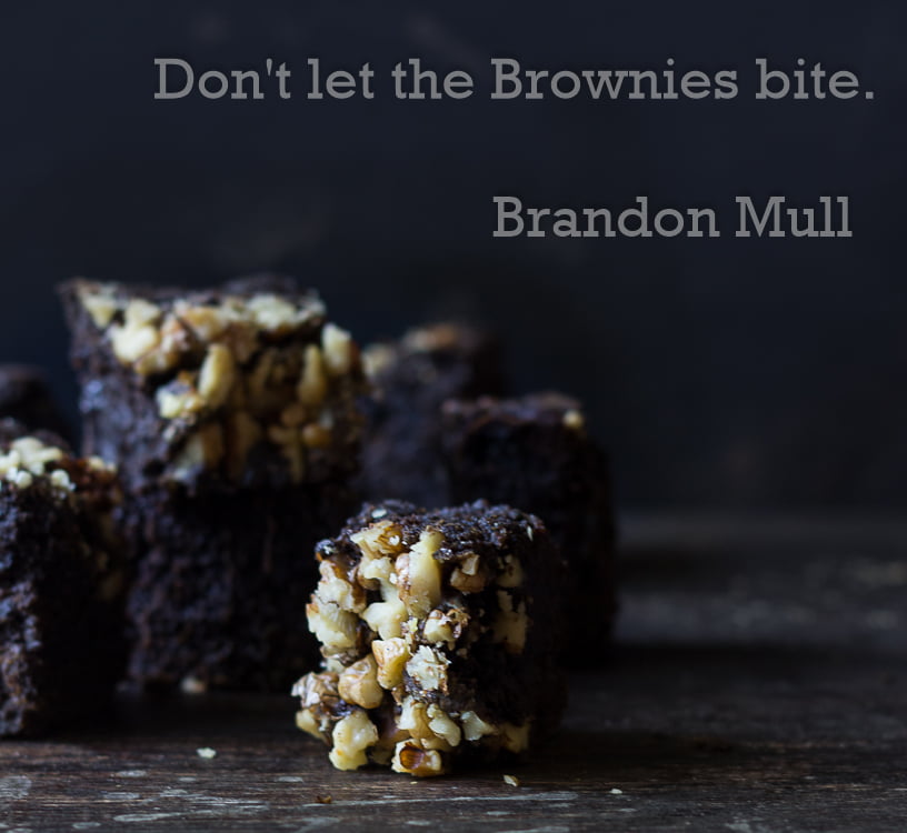 A plate of freshly baked Healthy Spinach Ragi Brownies topped with nuts