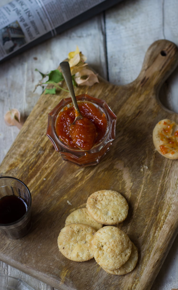 Lemon Chilli Pickle has been served with the snacks on a wooden tray