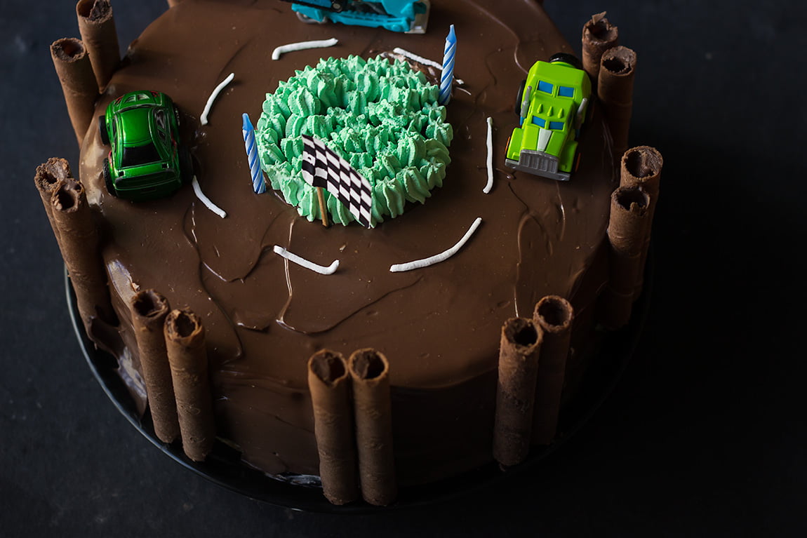 Race track cake placed on a table, ready to be served at a birthday celebration
