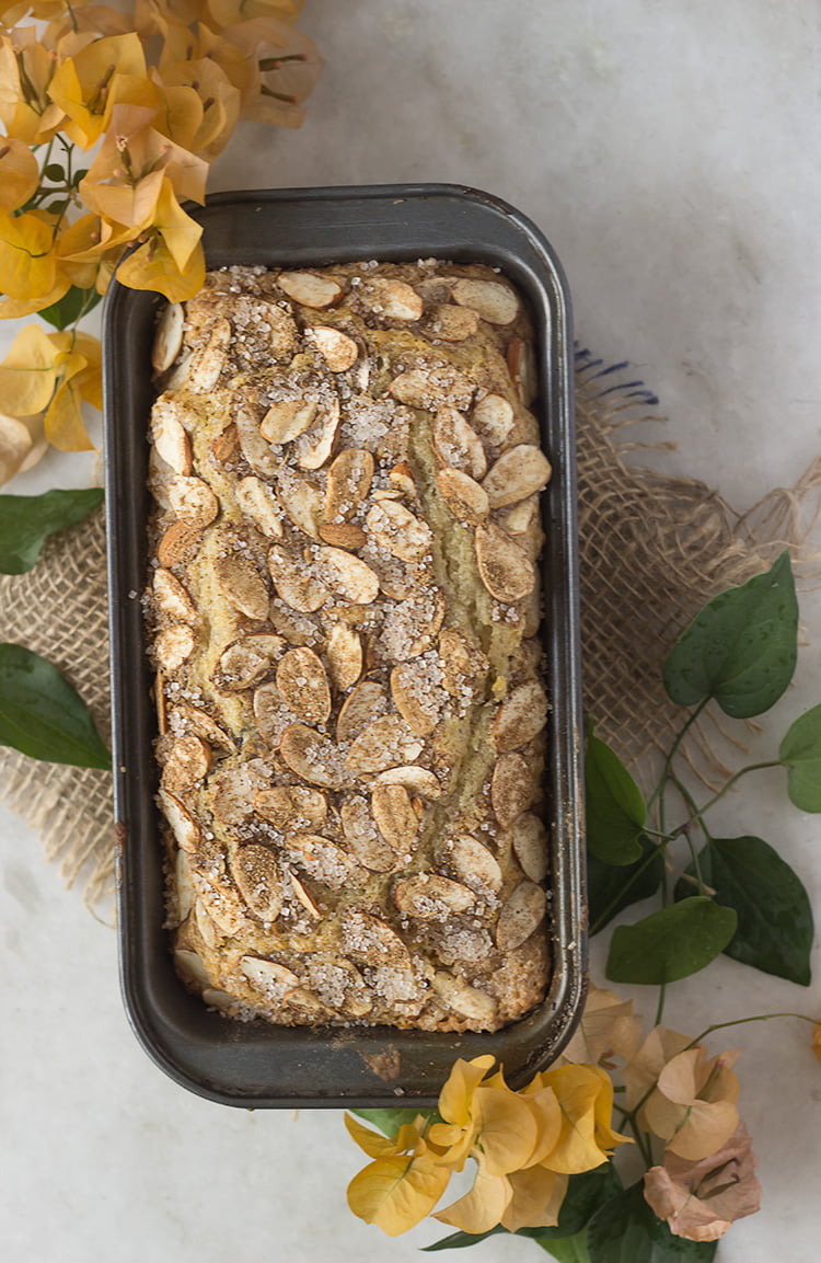 A beautifully decorated eggless cardamom cinnamon cake