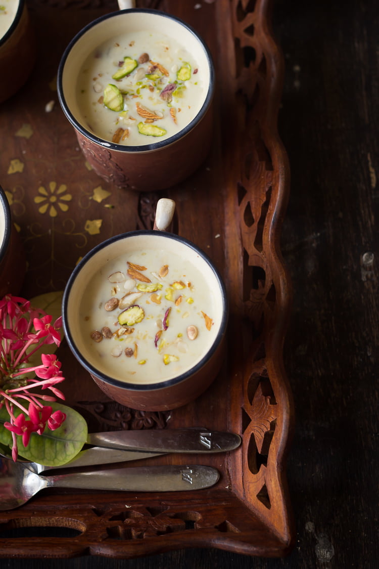 A beautifully presented bowl of Gur ki Kheer topped with chopped nuts