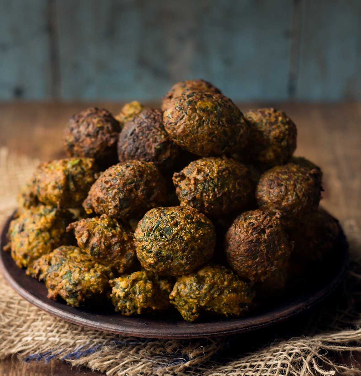 Close up view of a plate full of undhiyu balls