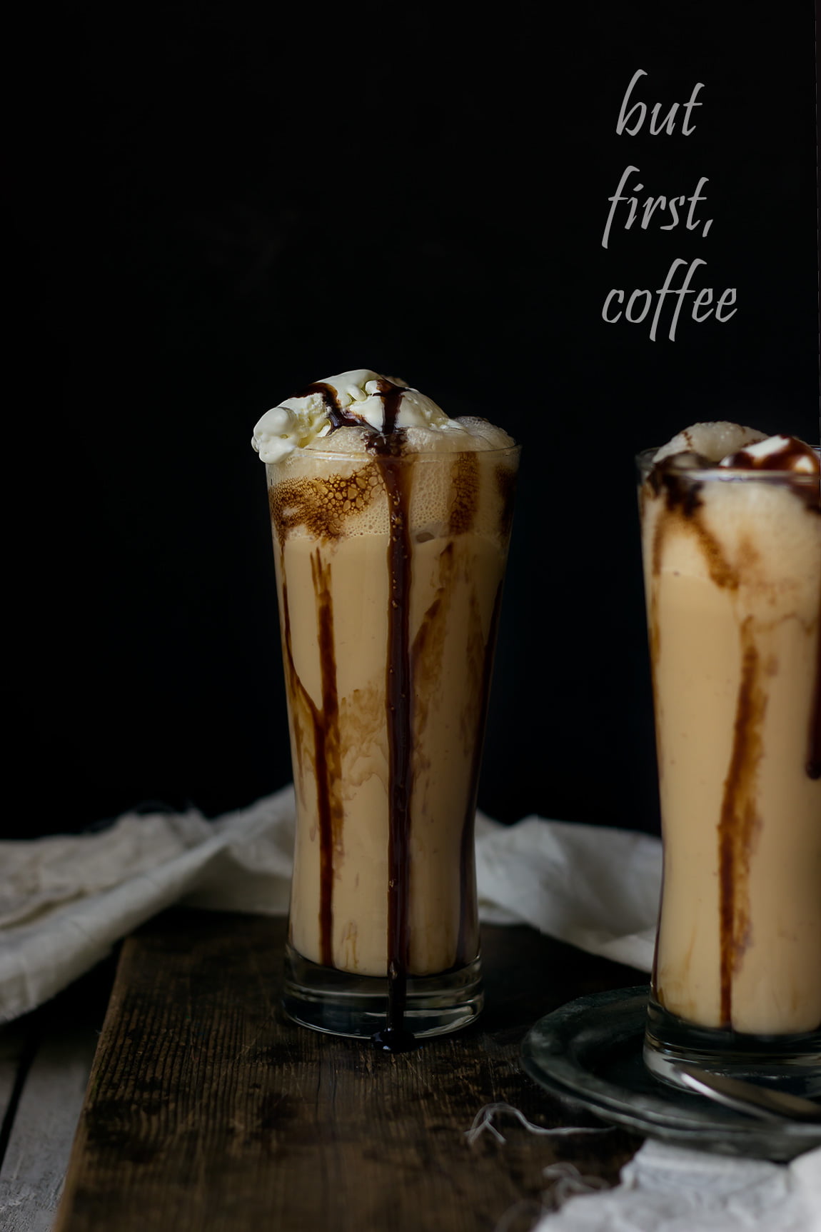 Two glasses filled with iced coffee frappe laid out on a table