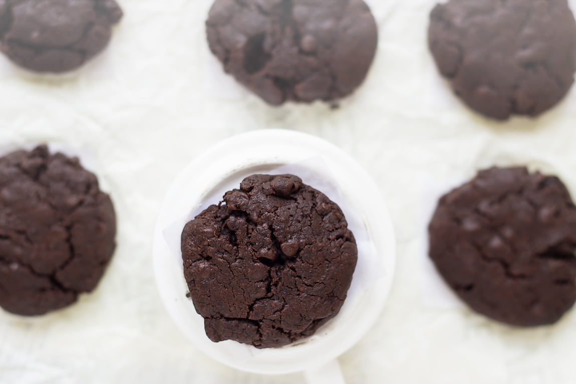 Close-up of gooey chocolate chips melting in a warm double chocolate cookie