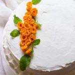 Decorative presentation of the eggless mango rose cake
