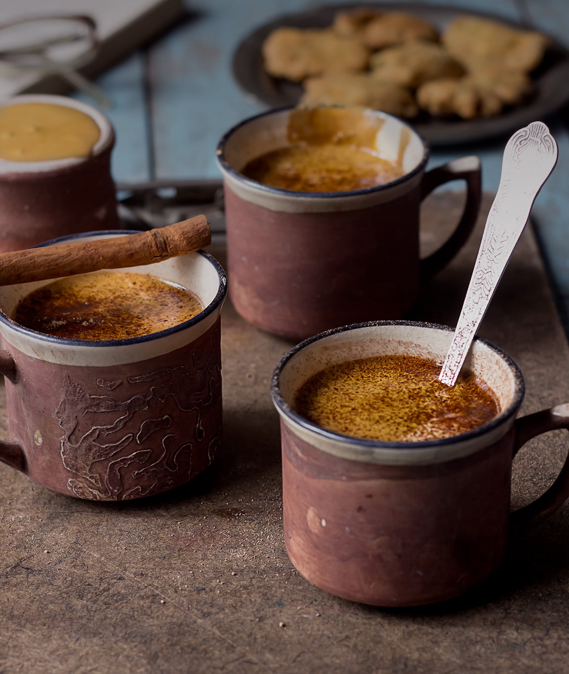 Whisking coffee and sugar mixture in a cup with a spoon