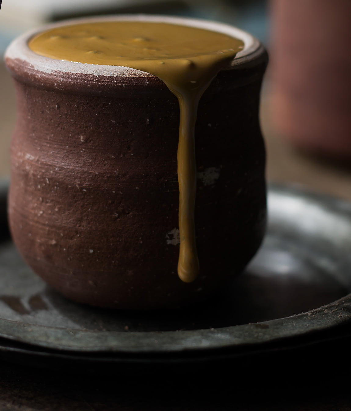 Close-up of frothy hand-beaten coffee in a small cup