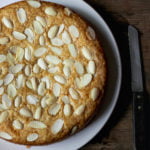 A beautifully decorated Eggless Kaju Cake topped with almonds