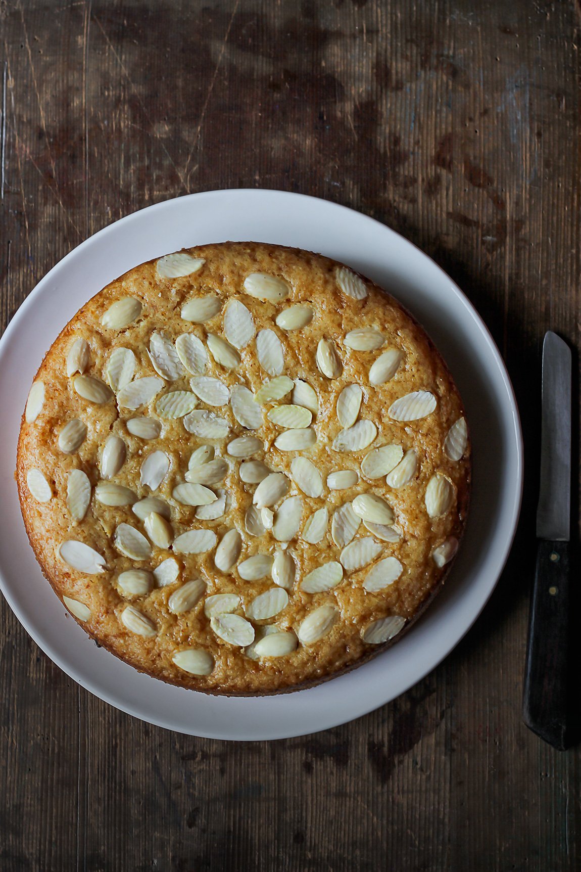 Close-up of a Eggless Cashew Cake with a golden crust and creamy texture
