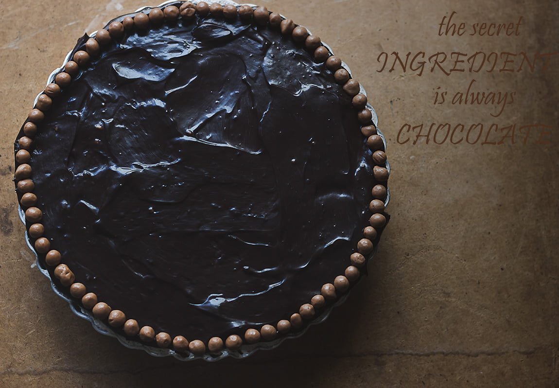A whole No-Bake Chocolate Mousse Cake with a glossy chocolate ganache topping