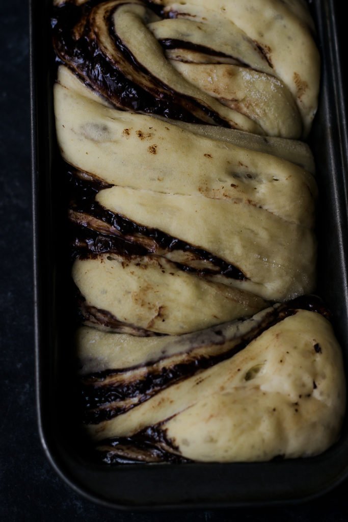 Golden-brown Chocolate Babka loaf fresh out of the oven, glistening with syrup