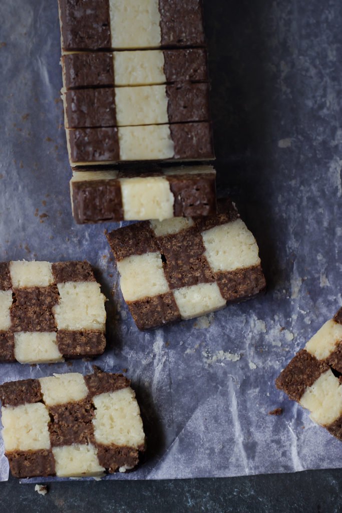 Sliced checkerboard cookie with a classic vanilla-chocolate pattern