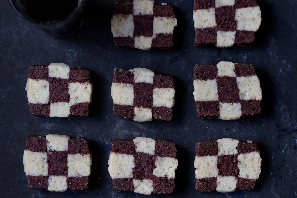 Checkerboard cookie arranged on a decorative serving plate