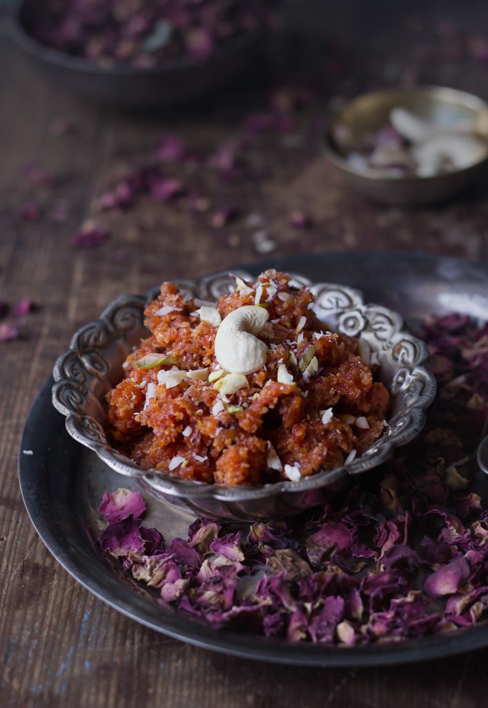 Gajar ka Halwa beautifully plated, garnished with nuts and a touch of saffron